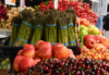 fresh fruits and vegetables on a stand